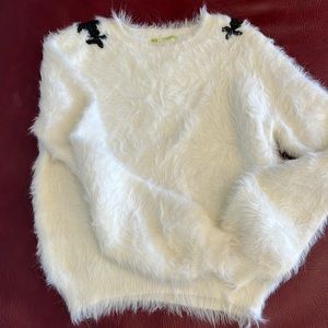 Gianni Bini cream sweater with black beaded appliqué on shoulder